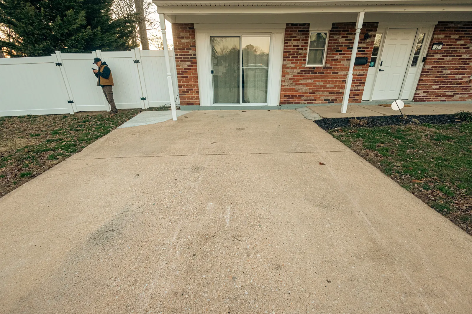 Concrete driveway leading to a residential garage in New Castle County, DE