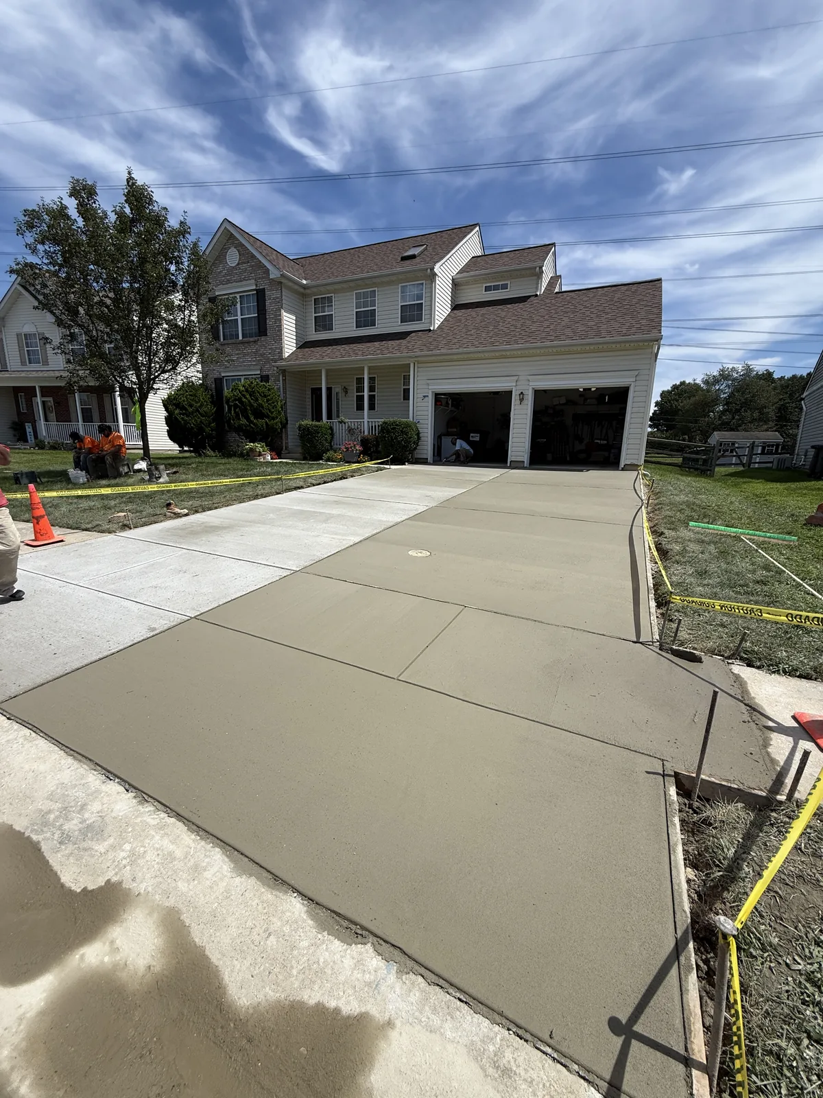 Wide finished concrete driveway at a New Castle County, DE home