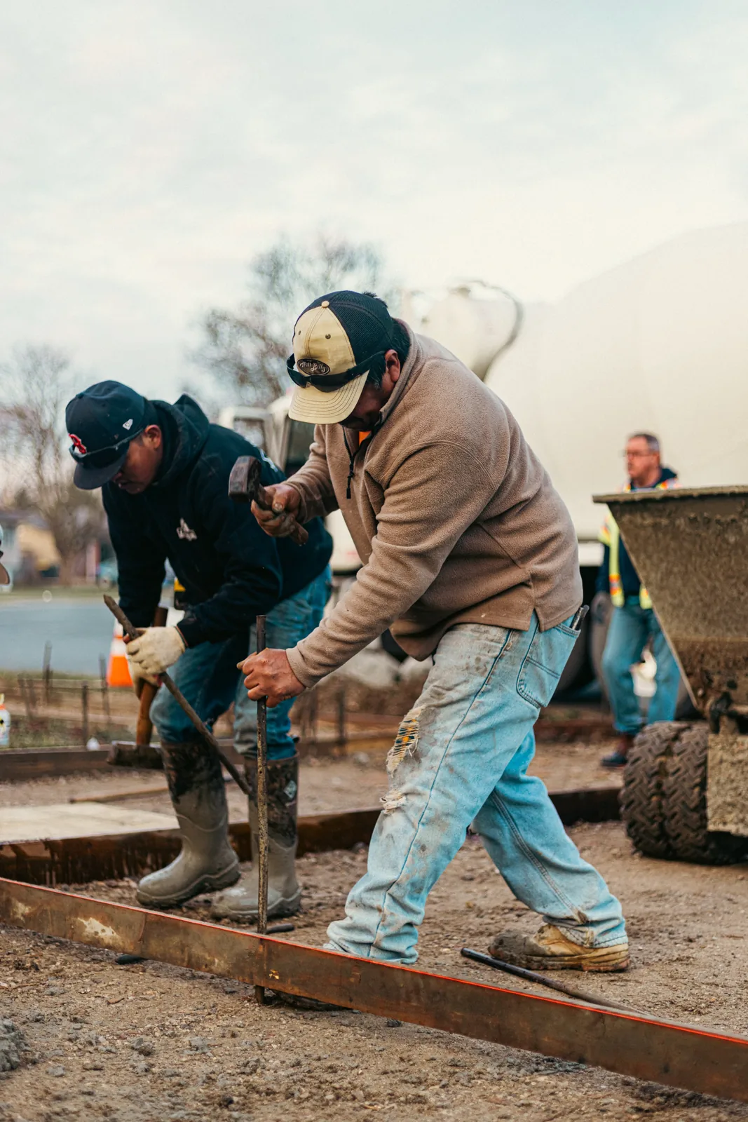 Crew screeding freshly poured concrete in New Castle County, DE