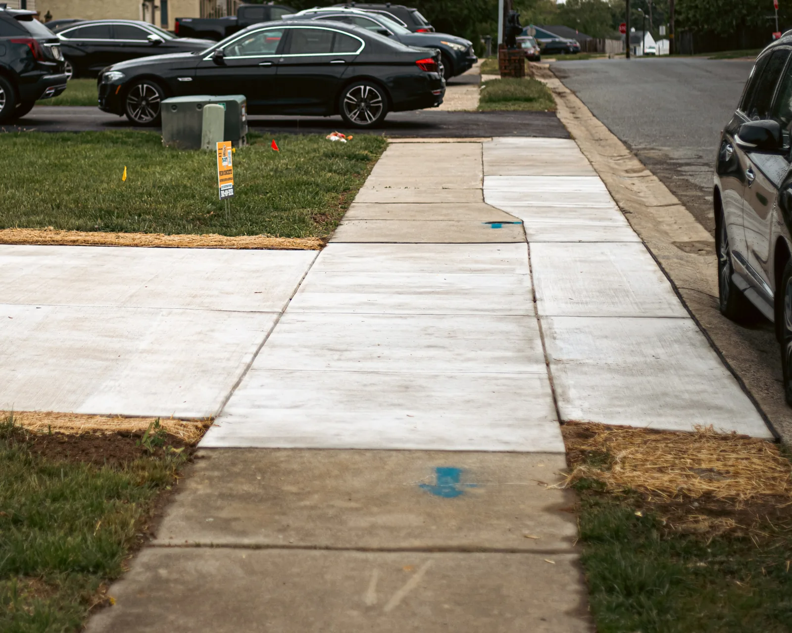 Long concrete sidewalk and walkway along a New Castle County, DE street