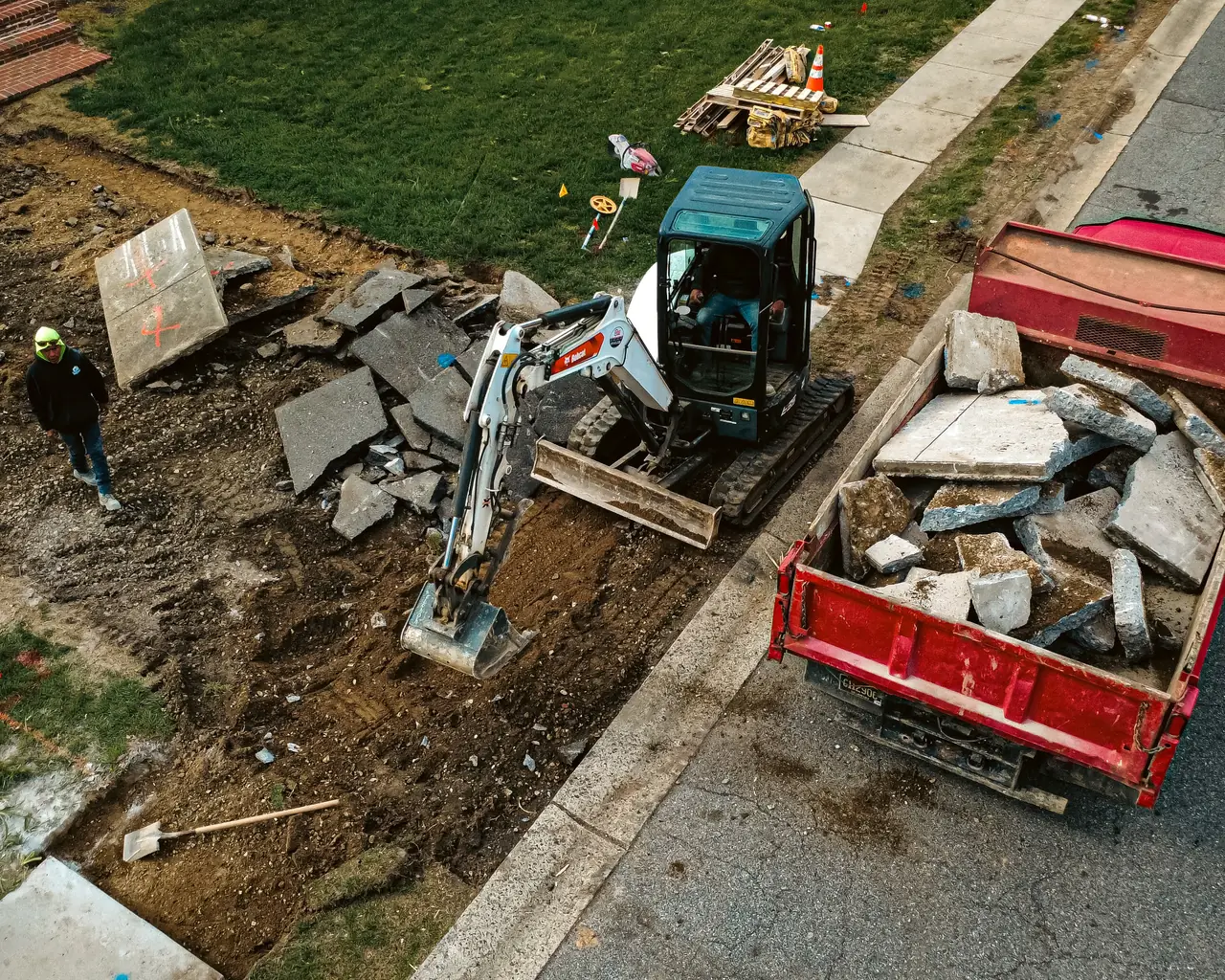 Aerial view of a concrete demolition job with debris dumpster in New Castle County, DE