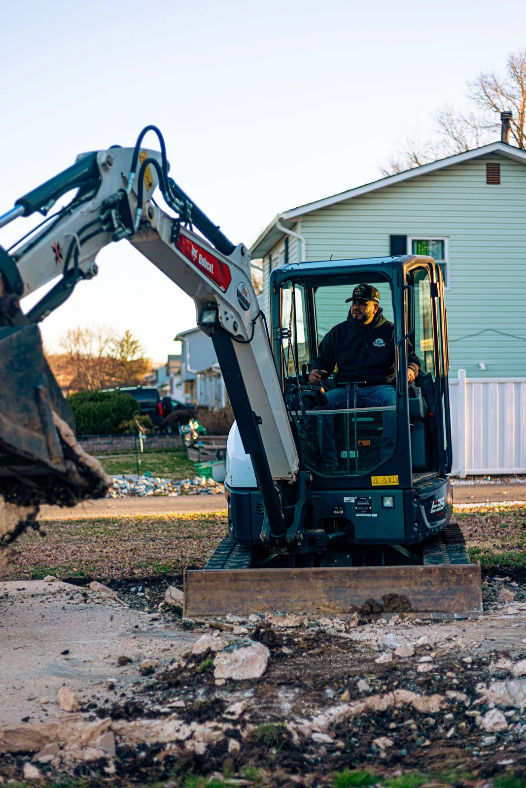 Mini excavator preparing a residential concrete site in New Castle County, DE