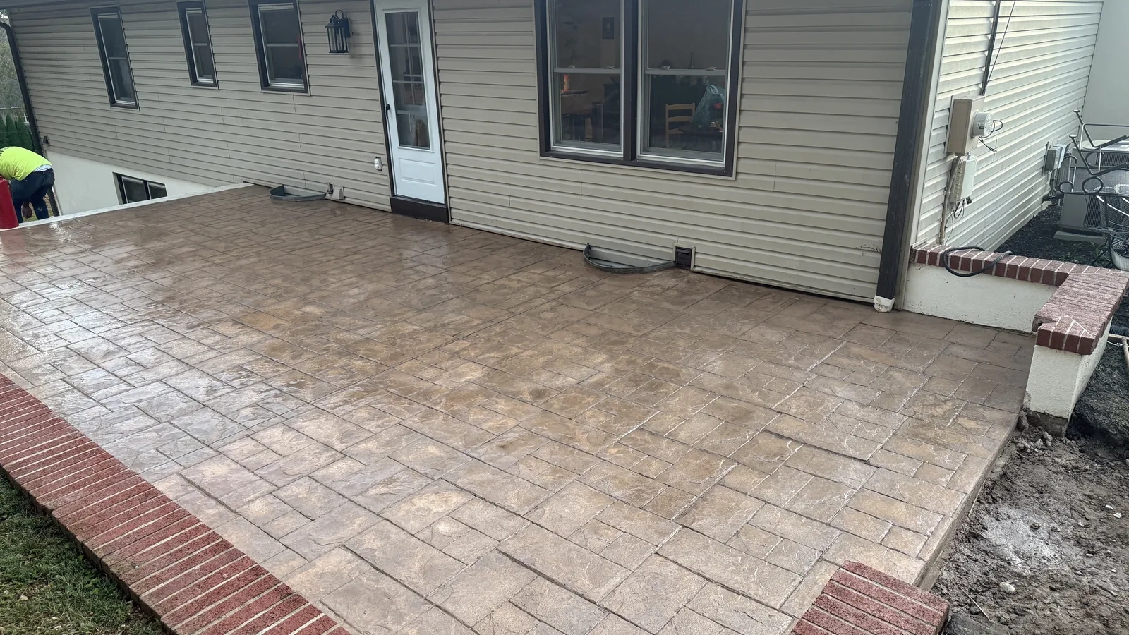 Stamped concrete patio running along a home in New Castle County, DE
