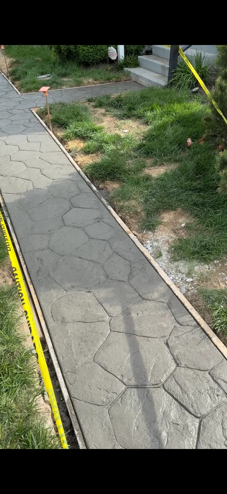 Stamped concrete walkway through a front yard in New Castle County, DE