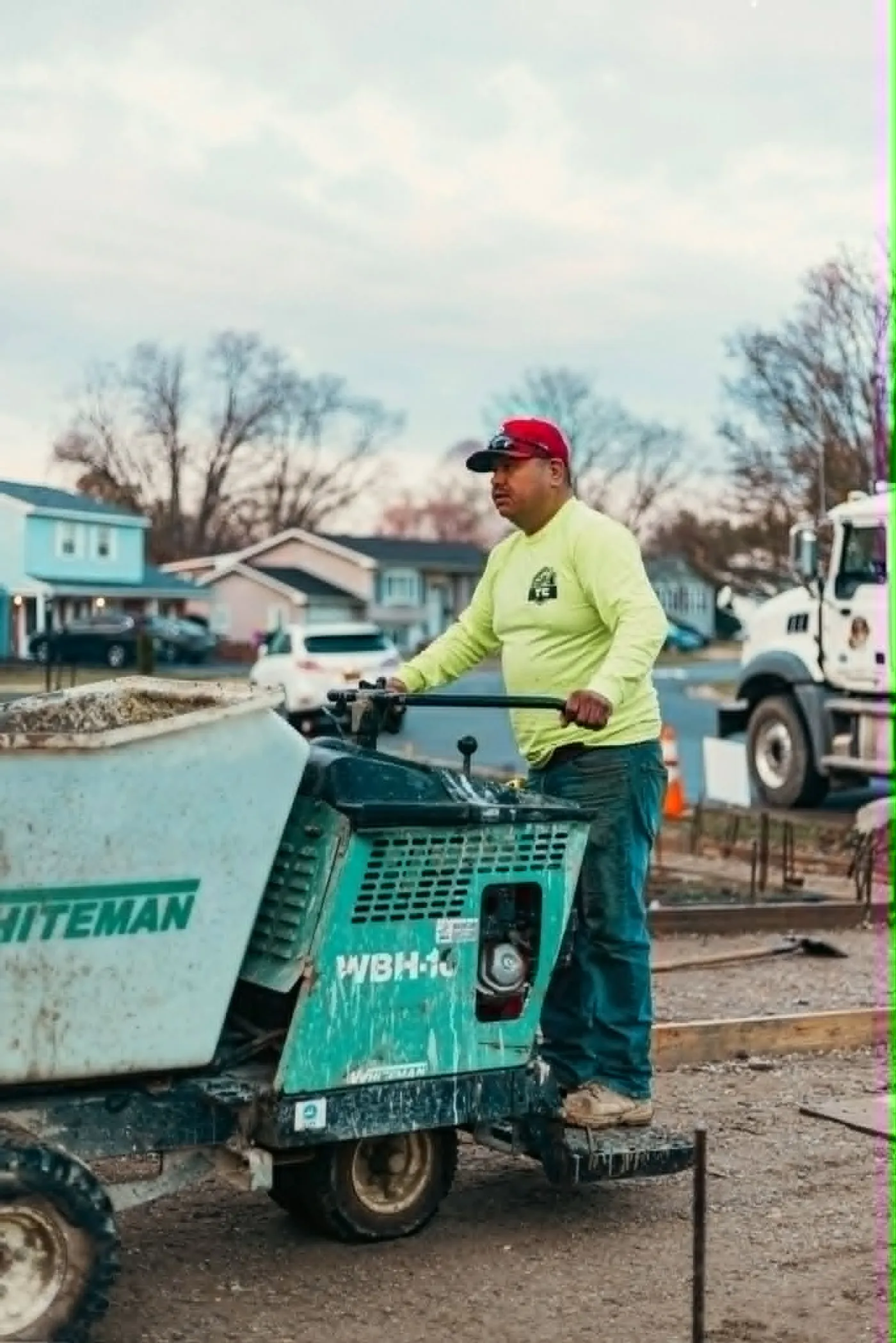Carlos Sr., co-owner of Tri-County Construction, pouring a concrete slab with a power buggy in New Castle County, DE